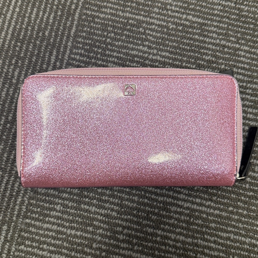 Kate spade mavis street needa wallet new, never used, but no tags. Pink.